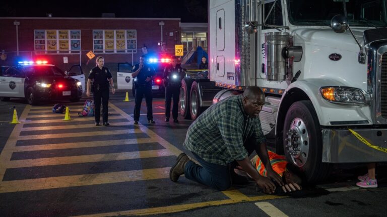 I’ve driven an 18-wheeler for 22 years, but when 6 squad cars boxed me in outside the elementary school—I heard the “wet gasping” near my tires and slowly dropped to my knees.